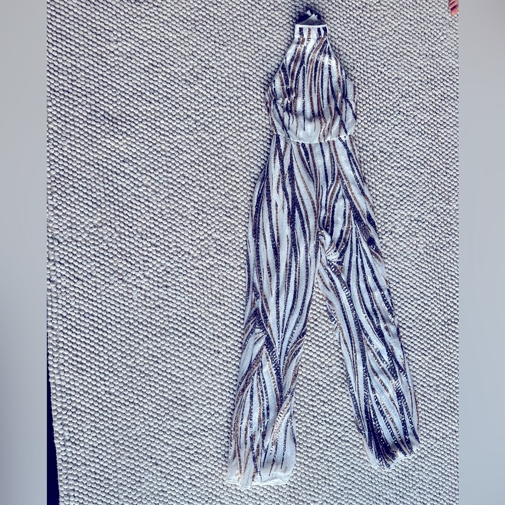Fun gold, silver, and white sequence jumper. Never worn.